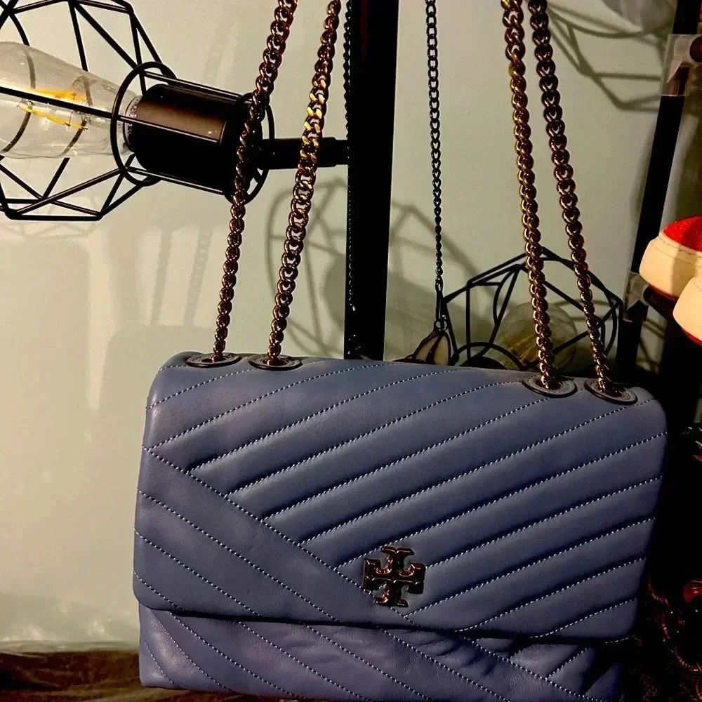 Tory Burch shoulder bag in beautiful lavender color never used .